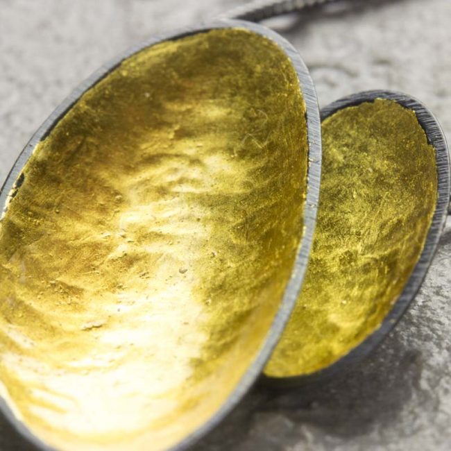 Two leaf silver necklace with yellow gold leaf