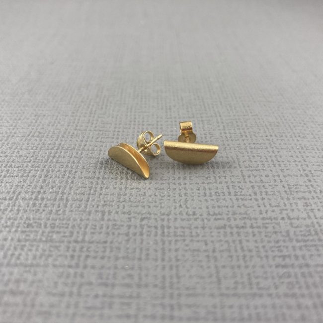 Gold plated folded circle stud earrings by Hilary Brown