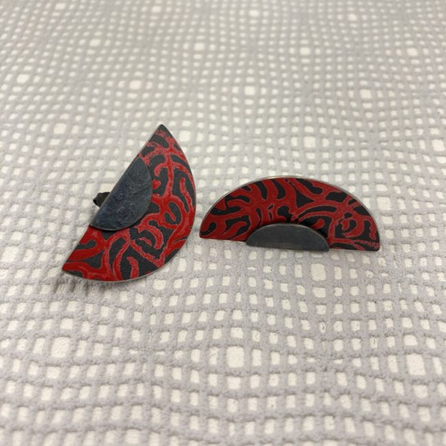 Alyssa semi-circle stud earrings in oxidised silver and red aluminium, by Penny Warren