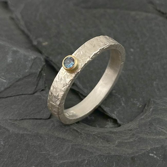 Textured silver ring with 18ct gold and aquamarine by Jenifer Wall