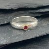 Silver D-shaped ring with ruby & 18ct gold by Jenifer Wall