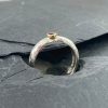 Silver D-shaped ring with ruby & 18ct gold by Jenifer Wall
