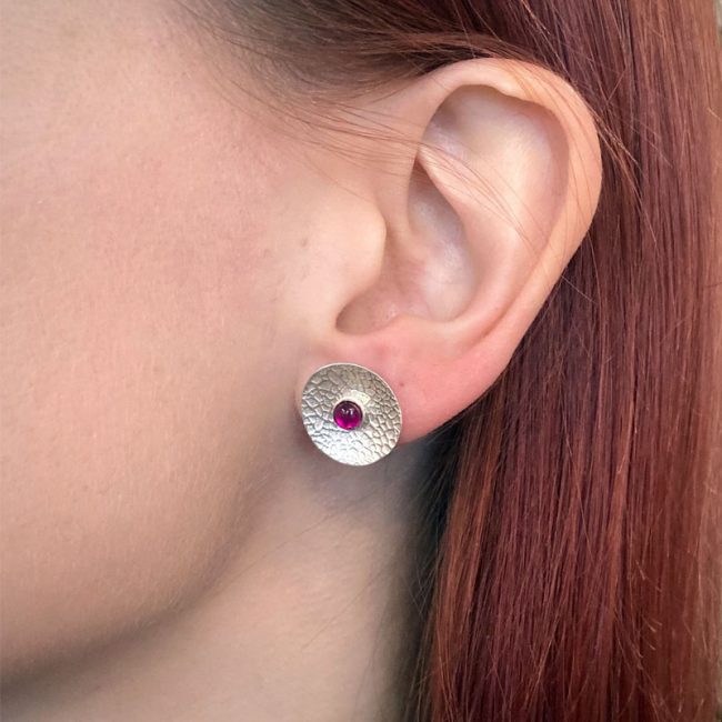 Textured silver concave disc earrings with detachable ruby studs by Rebecca Halstead