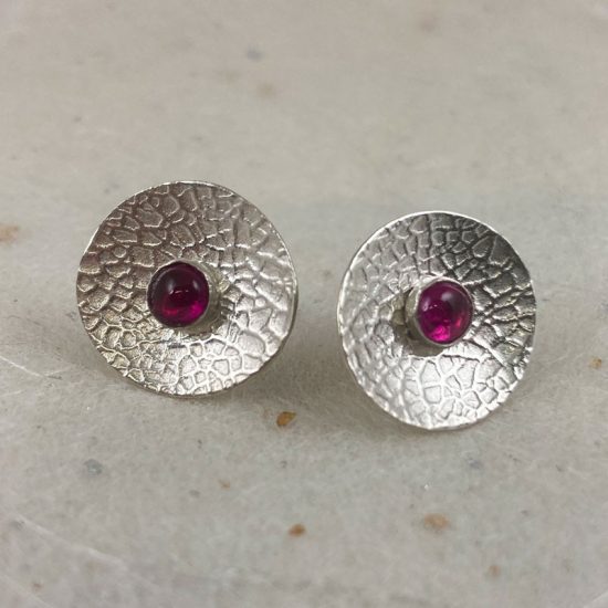 Textured silver concave disc earrings with detachable ruby studs by Rebecca Halstead