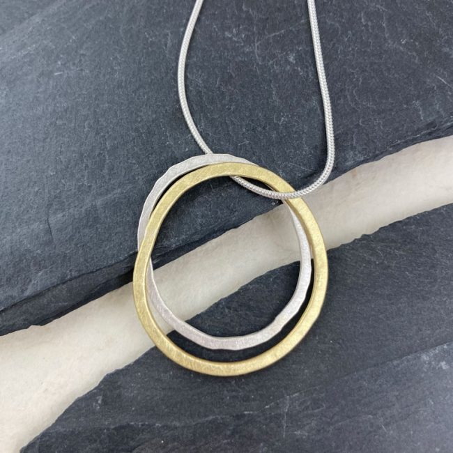 Silver and brass flat link pendants on silver snake chain by Samantha Maund