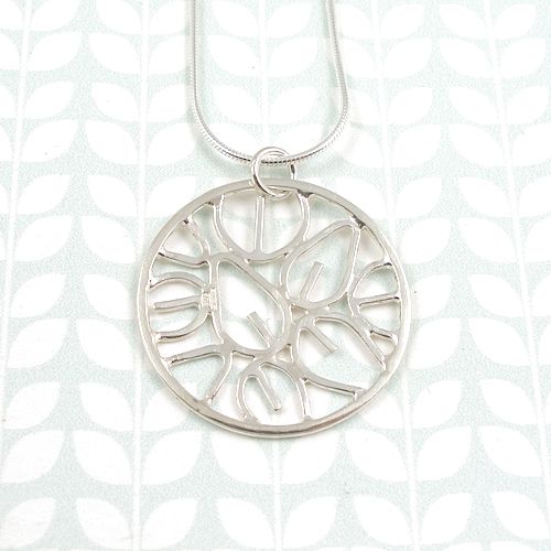 Round silver leaf outline pendant by Emma Leonard