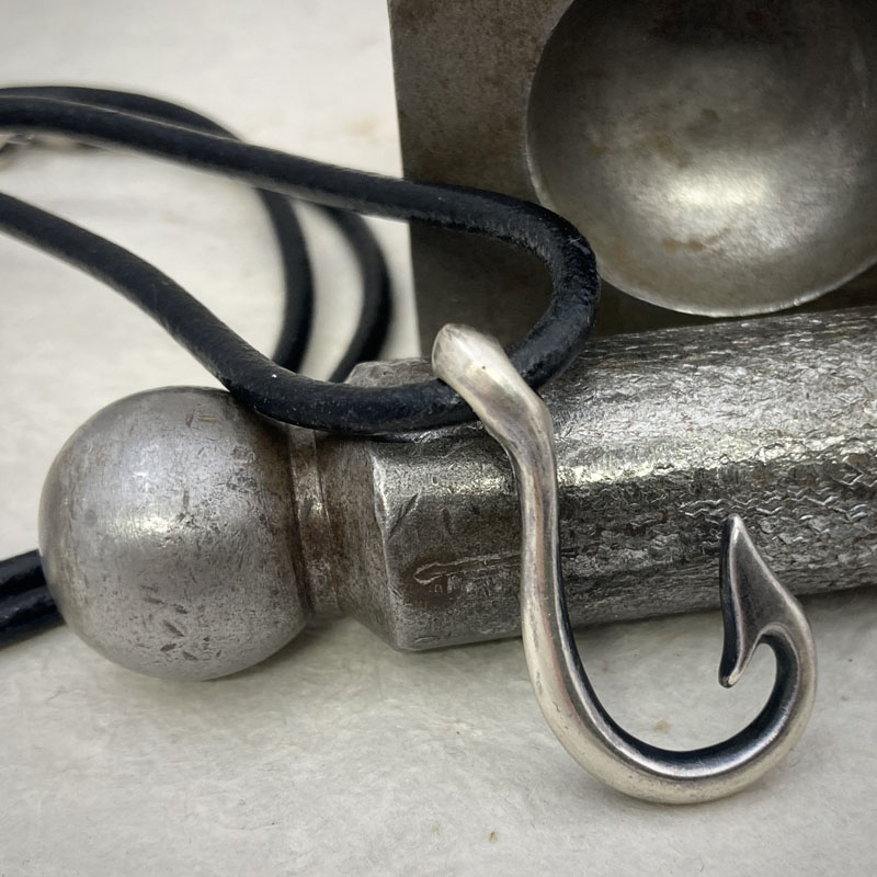 Silver Hook pendant on leather cord