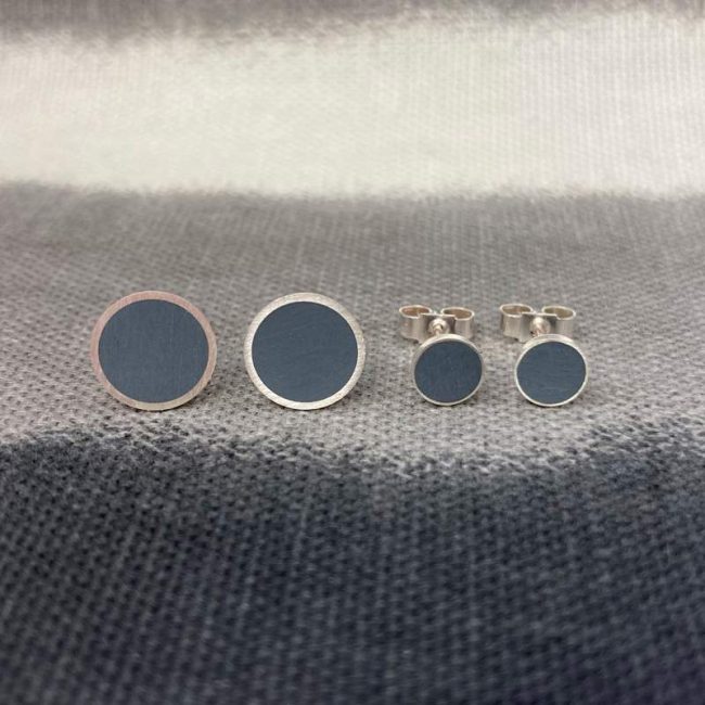 Grey resin and silver circular stud earrings by Claire Lowe