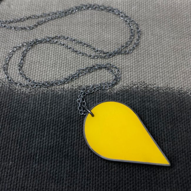 Large mustard resin & oxidised silver teardrop pendant by Claire Lowe