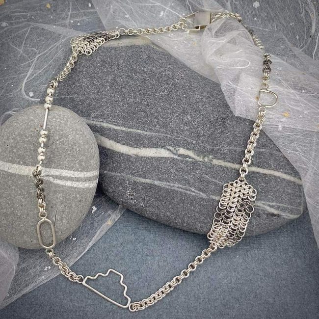 Cut Out silver and titanium chainmail necklace by Corrinne Eira Evans