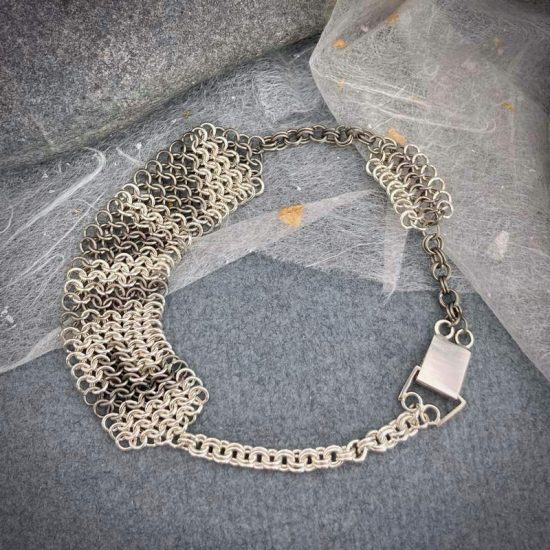 Line chainmail bracelet in silver and titanium by Corrinne Eira Evans