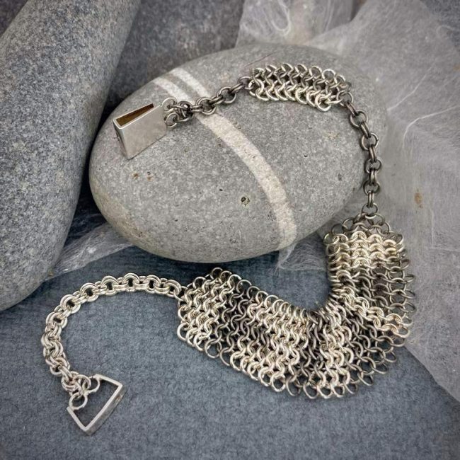 Line chainmail bracelet in silver and titanium by Corrinne Eira Evans