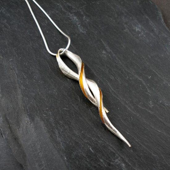 Cornucopia pendant in silver and part gold plated by Anne Massey