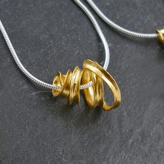 Gold plated Ribbon pendant by Anne Massey