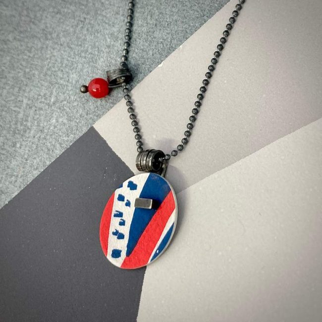 Pattern pendant in red and navy blue by Lindsey Mann