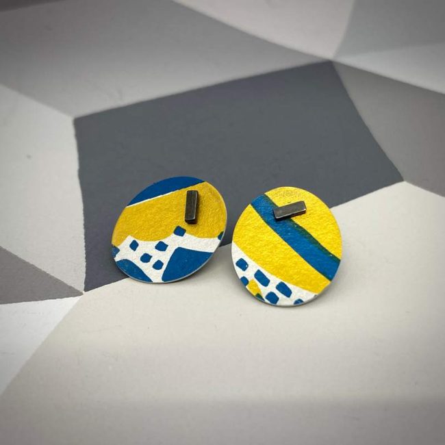 Large pattern stud earrings in yellow and navy blue by Lindsey Mann