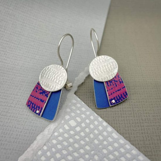 Trax silver oval drop earrings with pink and blue print on blue square by Penny Warren
