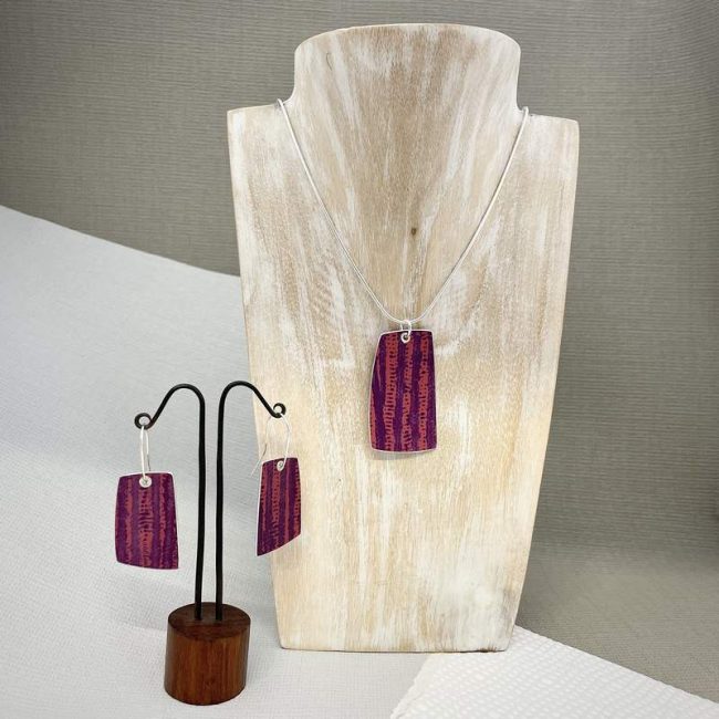 Trax large rectangular riveted pendant in berry and red by Penny Warren