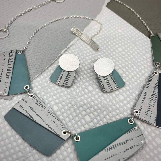 Trax large rectangle necklace and oval earrings in silver and printed anodised aluminium by Penny Warren