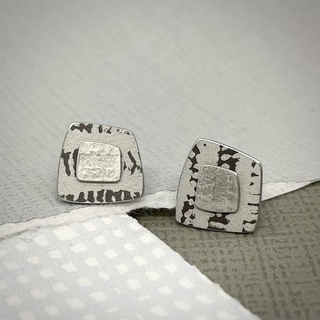 Trax square studs in silver with white and grey print by Penny Warren