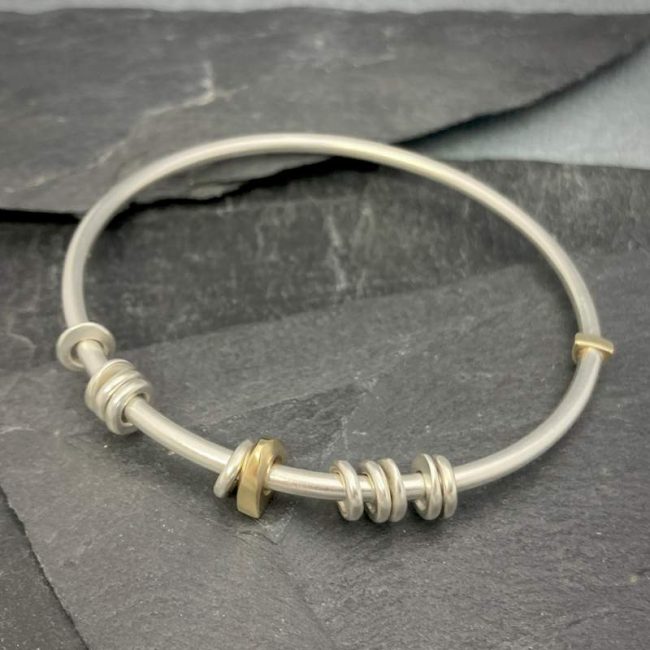 Idun solid bangle in silver and 18ct gold by Annika Rutlin