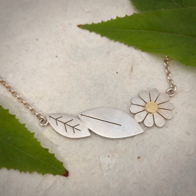 Two leaves and a Daisy necklace in silver and 18ct gold by Diana Greenwood