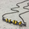 Cluster bar necklace in oxidised silver 22ct gold leaf